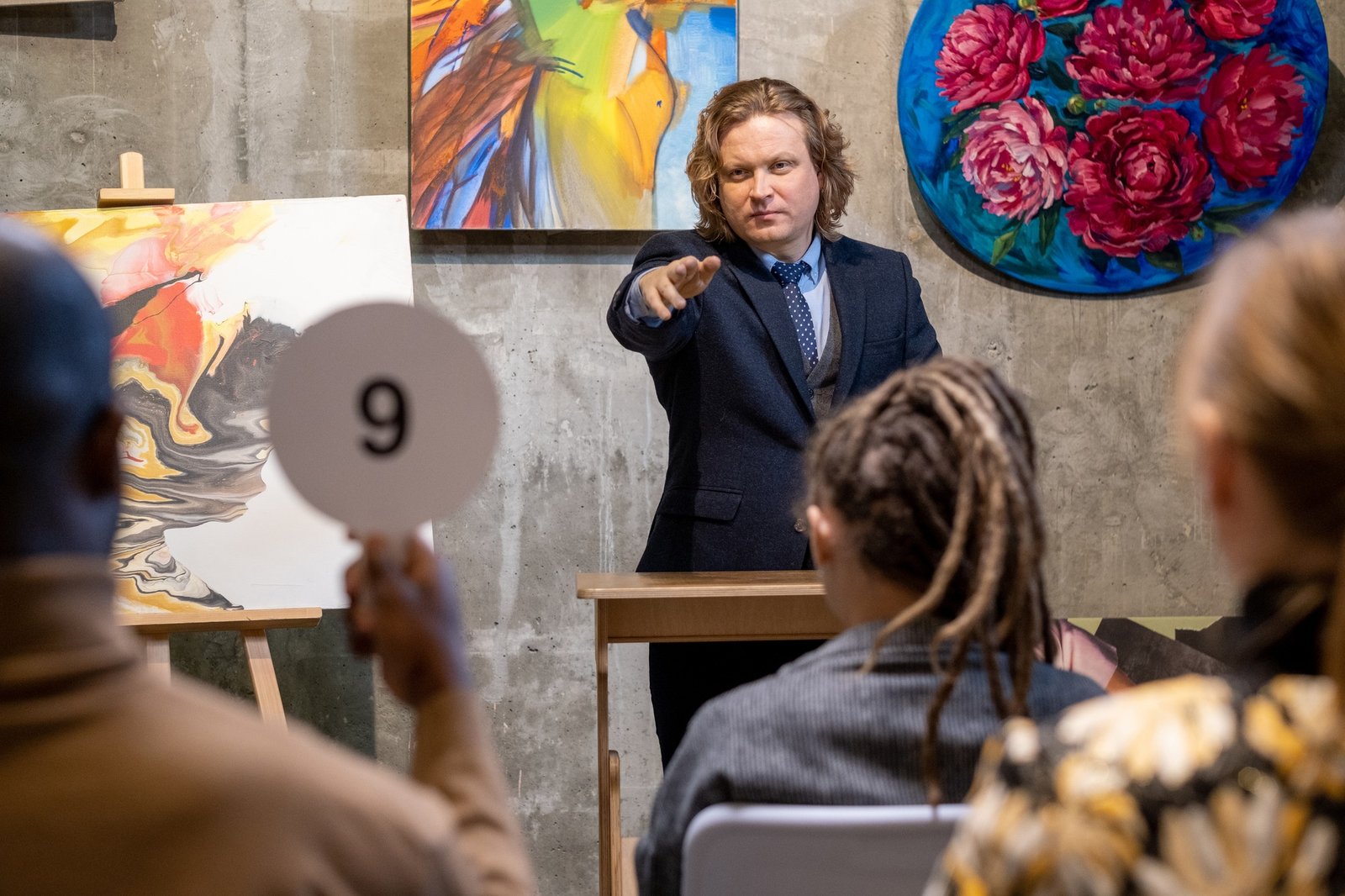 Man selling the paintings on auction